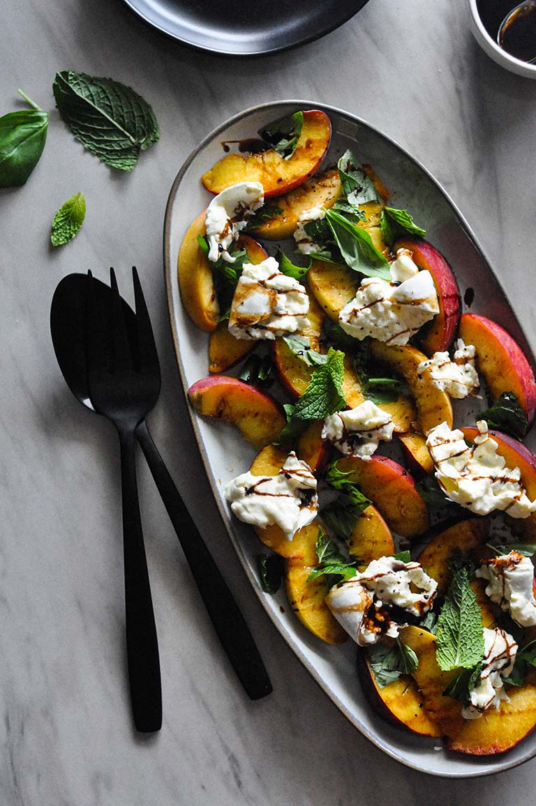This Peach & Burrata Caprese Salad is a refreshing spin off the OG Caprese Salad. This salad has juicy, ripe peaches, creamy burrata, fresh basil and mint, all drizzled with an easy balsamic reduction.